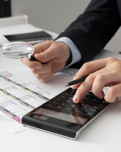 business man calculating finance numbers_23 2148793750